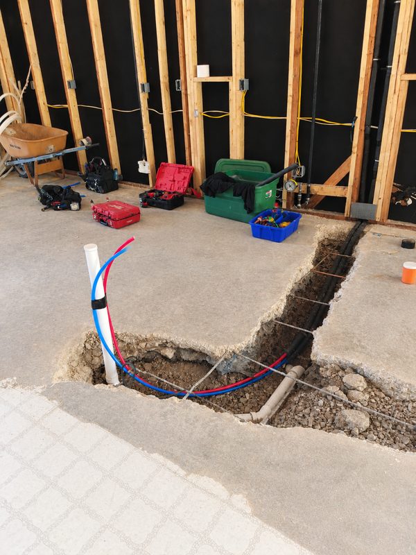 Concrete trench with new drain and PEX supply lines
