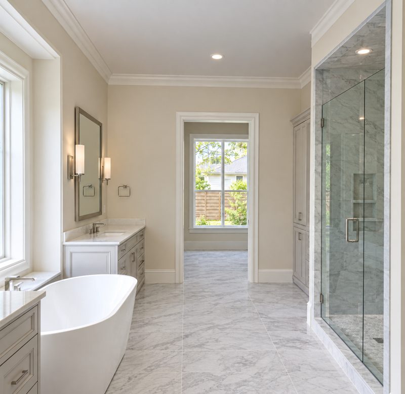 Master bathroom with freestanding tub and glass shower